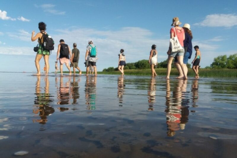 People walking into a sea