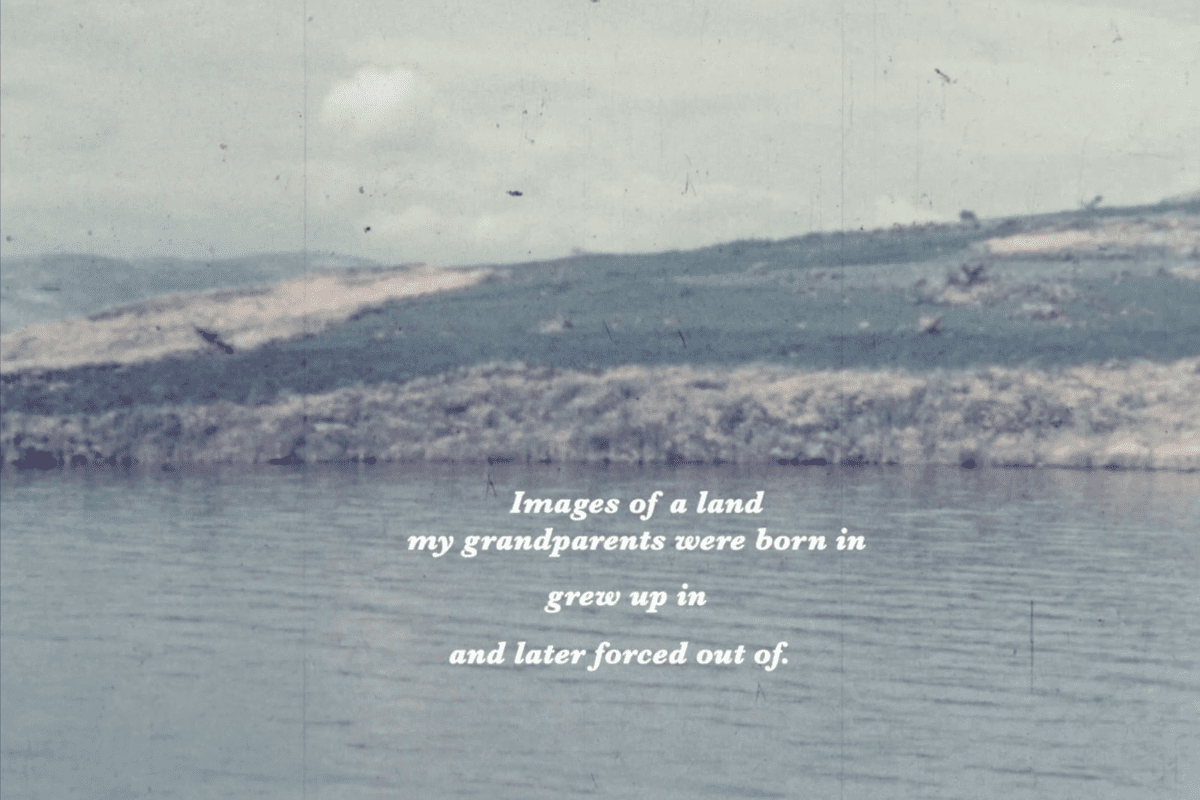 Archival film still of a lake. Text overlayed reads 'images of a land my grandparents were born in / grew up in / and later forced out of.'