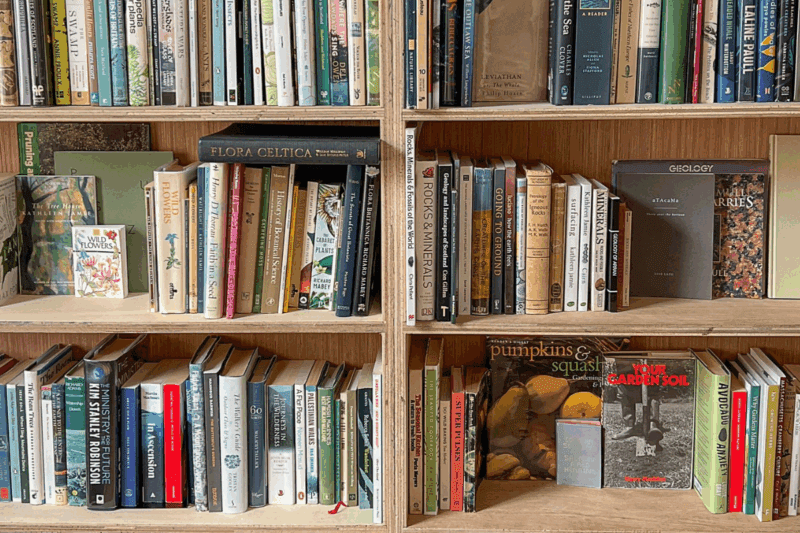 Library shelves full of books about nature