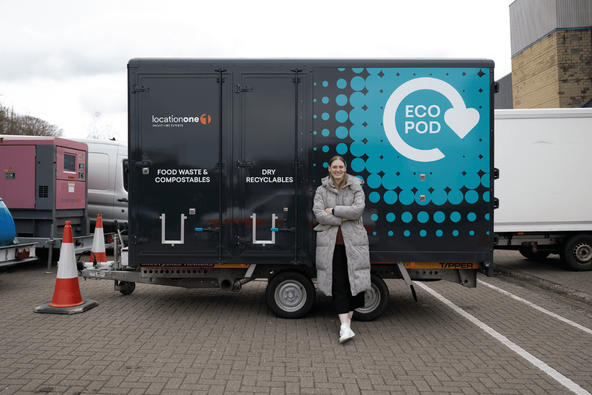 A person standing in front of Ecopod waste collection van