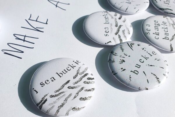 Patterned badges with text 'Buckie' 'I sea Buckie' 'Sea Change Buckie'
