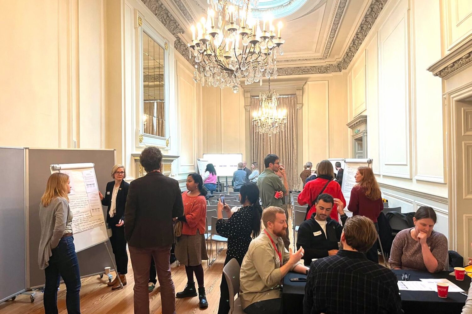 Room full of participants, discussing audience travel workshop scenarios